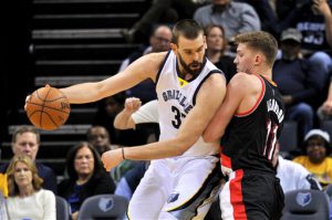 Memphis Grizzlies center Marc Gasol, left, controls the ball against Portland Trail Blazers forward Meyers Leonard (11) in the first half of an NBA basketball game Monday, Feb. 8, 2016, in Memphis, Tenn. (AP Photo/Brandon Dill)