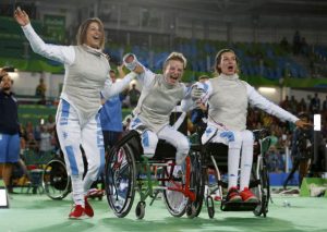 2016 Rio Paralympics - Wheelchair Fencing - Bronze Medal Match - Women's Foil Team - Carioca Arena 3 - Rio de Janeiro, Brazil - 16/09/2016. Italy's Beatrice Vio, Loredana Trigilia, and Andreea Mogos celebrate after beating Hong Kong.  REUTERS/Carlos Garcia Rawlins FOR EDITORIAL USE ONLY. NOT FOR SALE FOR MARKETING OR ADVERTISING CAMPAIGNS.