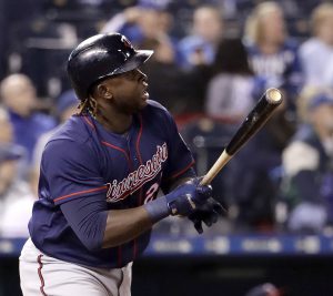 Minnesota Twins' Miguel Sano watches his two-run double during the eighth inning of a baseball game against the Kansas City Royals Friday, April 28, 2017, in Kansas City, Mo. (AP Photo/Charlie Riedel)