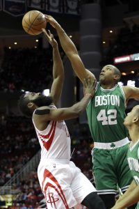 Boston Celtics' Al Horford (42) blocks a shot by Houston Rockets' James Harden (13) during the first quarter of an NBA basketball game, Monday, Dec. 5, 2016, in Houston. (AP Photo/David J. Phillip)